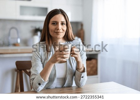 Thinking, planning and working from home on laptop while entrepreneur drinks coffee, tea or hot drink to help concentrate. Freelance blogger or writer with vision ideas, strategy and blog innovation.