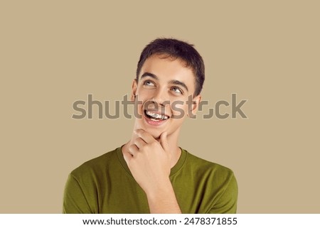 Thinking smiling surprised smart active teen pensive to discover, examine new, young man teenage person. Happy to study, showing interest to learn new information, discover problems, opinion, belief