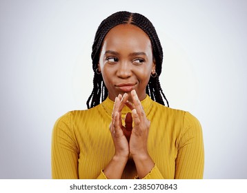 Thinking, smirk and black woman with scheme hands in studio for evil, planning or revenge on grey background. Plotting, villain and African female model with steeple emoji for brainstorming idea
