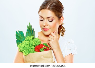 Thinking Woman Close Up Portrait With Green Food. Diet Concept . White Background .