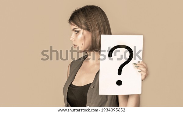 Thinking woman with question mark. Paper\
notes with question marks. Doubtful girl asking questions to\
himself. Confused female thinking with question\
mark.