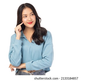 Thinking young asian woman standing isolated over white background Looking aside to copy space with happy and smile face Thoughtful female youngster keeps fore finger near cheek being deep in thoughts - Shutterstock ID 2133184857
