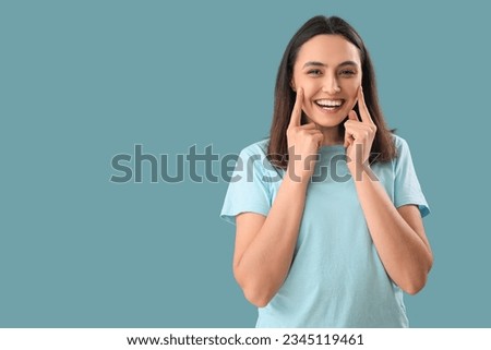 Thinking young woman on blue background
