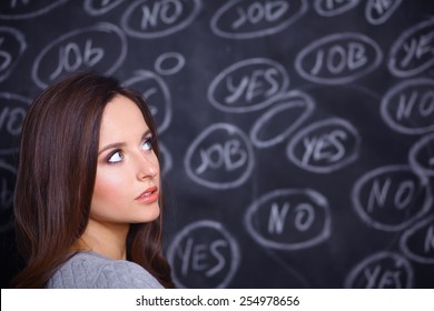 Thinking Young Woman With Yes Or No Choice On Grey Background