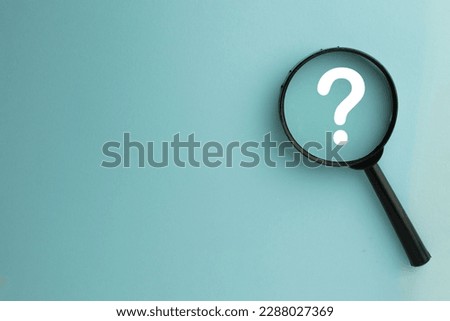 Thinking,Creative,Question,Solution,confusion concept.,Magnifying glass focus on Question mark icon over blue sky background with copyspace for put your text or logo