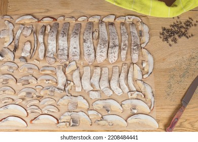 Thinly Sliced Mushrooms Ready To Drying. Boletus Cutting For Long Term Storage. On The Baking Paper. 