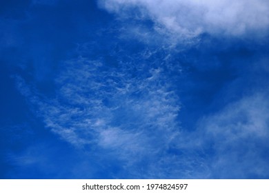 THINLY SPREAD WHITE CLOUD IN BLUE SKY