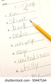 A Third Grade Spelling Test And Pencil Shows A Corrected Grade Of An A For 11/11.