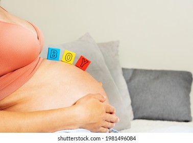 Third Trimester Woman Belly And Boy Word Of Blocks