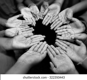 Third World Kid Hands Round Praying For God Present To Lift Up Their Life