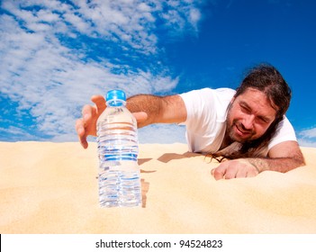 Thirsty Man In The Desert Reaches For A Bottle Of Water