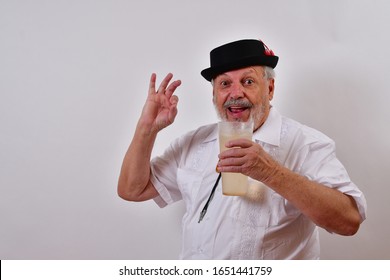 Thirsty Old Man Enjoying A Tall Glass Of Lemonade.
Elderly Gentleman Drinking A Healthy Glass Of Lemonade.
Senior Man Really Likes His Lemonade