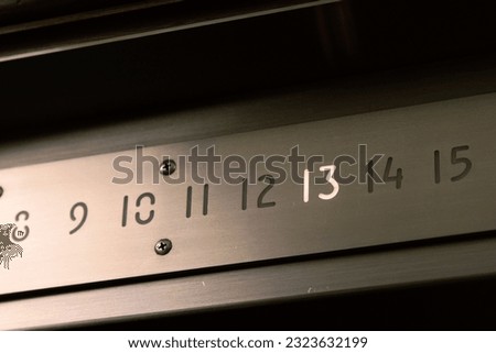 The Thirteenth Floor Illuminated on an Elevator
