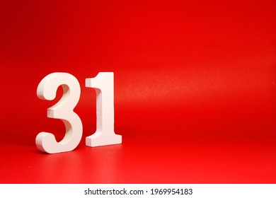 Thirty one ( 31 ) white number wooden Isolated Red Background with Copy Space - New promotion 31% Percentage  Business finance Concept                          