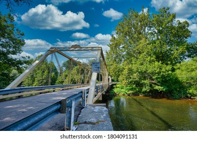 This 7 panel pin connected through truss bridge over the Raritan River, was built in 1890 and is located Three Bridges, New Jersey.