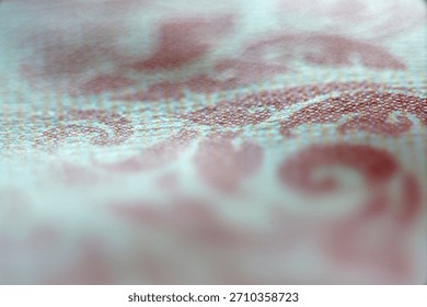 This abstract textile pattern features intricate swirls and a soft texture, creating a visually appealing backdrop suitable for various creative applications.