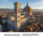 This aerial drone photo shows the famous Duomo, which is a large dome and cathedral in the historical city center of Florence, the capital of Tuscany, Italy.