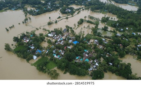 This aerial photograph captures the devastating impact of flooding in Bangladesh, where rising floodwaters have submerged roads, homes, and surrounding farmland, disrupting daily life  chittagong, Bangladesh