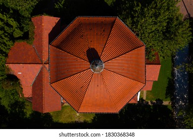 This is an aerial view of the orange tile roof of the abandoned Saints Constantine & Helen Greek Orthodox Church in downtown Newport News, Virginia.