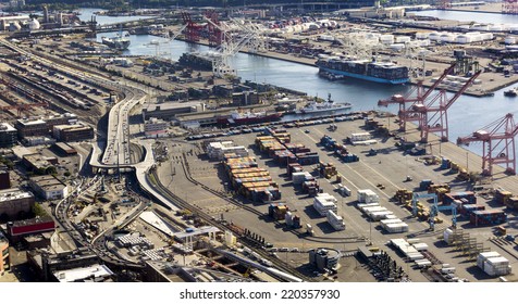 This Aerial View Of The Port Of Seattle Washington Exemplifies The Amount Of Shipping And Transportation Business This Industrial Center Manages.