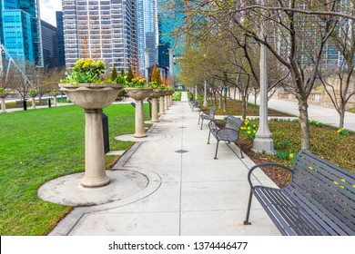 This Amazing Millenium Park Side Walk With Multiple Seats Arranged On A Leading Lines To View The Beutiful Architect Of Chicago.