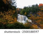 This is an autumn view of the roaring Blackwater Falls along the Blackwater River within Blackwater Falls State Park in West Virginia.