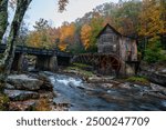 This is an autumnal view of the scenic Glade Creek Grist Mill, which is located along Glade Creek within Babcock State Park in West Virginia.