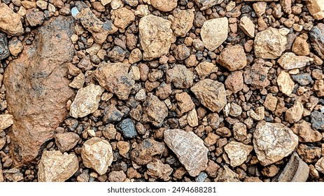 This is a background image of a pattern on light brown gravel