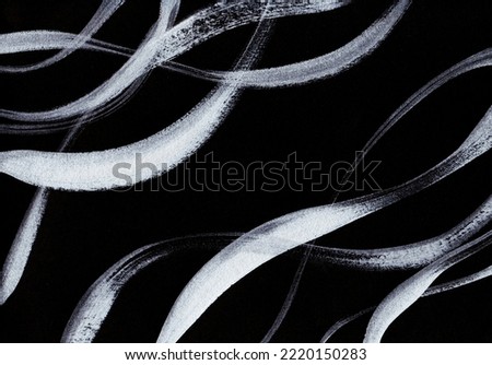 This is a background image with silver streamlines drawn with a brush on a black background
