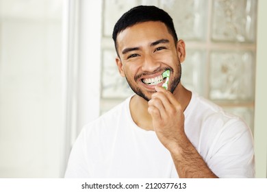 This Is The Best Toothpaste, The Proof Is In My Smile. Shot Of A Handsome Young Man Brushing His Teeth At Home.