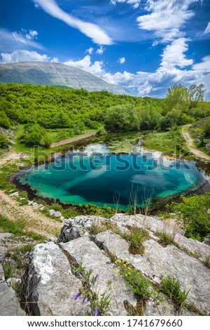 This is the biggest, and deepest (more than 100 meters deep), of all three wellsprings, of river Cetina, with the highest mountain in Croatia named Dinara, in the background.