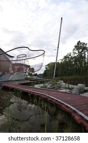 This Is The Board Walk At The Richmond Olympic Oval With A Fish Net In Background.