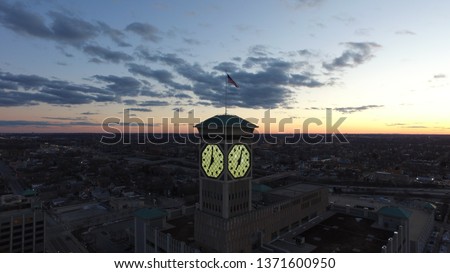 This is the Bradley Clock Tower at dusk. This is showcasing the clock tower lit up at night with a beautiful skyline behind it. Anyone in Milwaukee would recognize this building because of its history