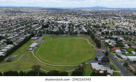 This breathtaking footage takes you over the cricket pitch, offering a unique bird’s-eye view of the stadium as it glows under the lights, set against the city skyline. - Powered by Shutterstock