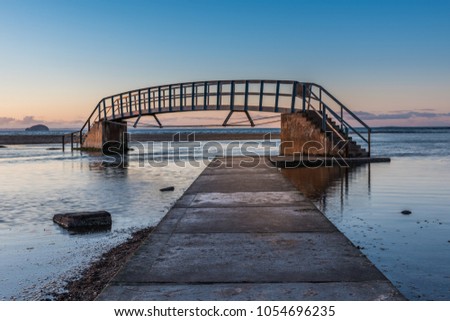 This bridge is known as 'The Bridge To Nowhere' and was built as part of Dunbar's Victorian beach improvement scheme. It crosses Biel Water where it flows in Belhaven Bay and the orth Sea at Dunbar