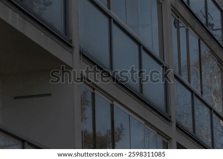 This is a building that features a substantial number of windows and balconies, enhancing its architectural design and aesthetic appeal