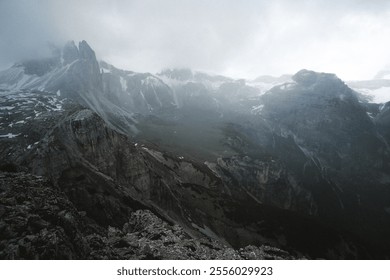 This is a captivating black and white photograph depicting a majestic and rugged mountain range, showcasing its natural beauty and grandeur - Powered by Shutterstock