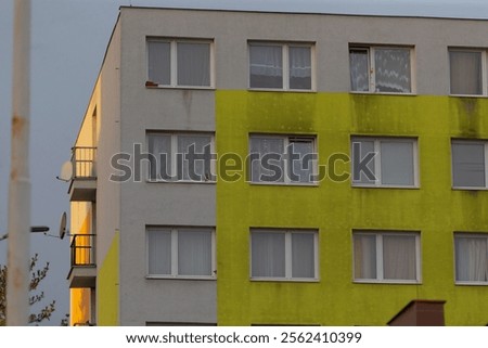 This captivating building features a unique twotone design with multiple windows enhancing its appeal
