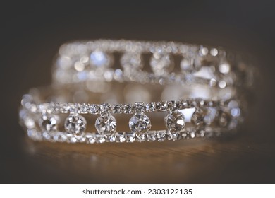 This captivating image showcases a creative and artistic photograph of bridal accessories, including earrings, shoes, garters, jewelry, and perfume.  - Powered by Shutterstock