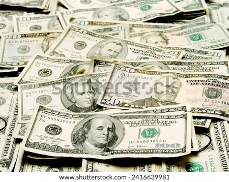 This captivating image showcases a substantial pile of money, exuding wealth and prosperity. The stack of bills, neatly arranged, symbolizes financial abundance and success.