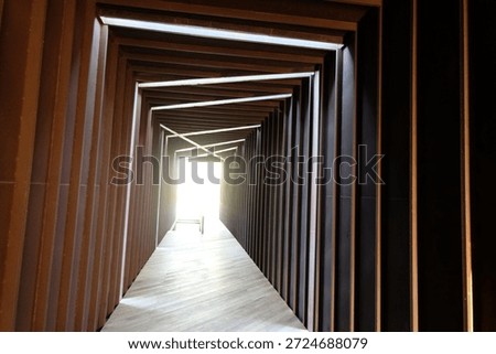 This captivating shot features a rhythmic sequence of timber frames, masterfully illuminated by linear lighting to create a profound sense of depth and perspective."