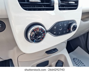 This car features a sleek interior with a stateoftheart climate control console for easy customization of air conditioning and heating, ensuring passenger comfort