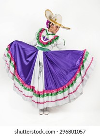 This charming dancer is wearing a picturesque dress used in the state of Aguascalientes in Mexico. She joins fiesta and rodeo events with other dancers as part of the folk culture.