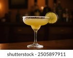 This is a Classic Margarita, a refreshing cocktail served in a margarita glass with a salted rim and garnished with a lime slice. The drink