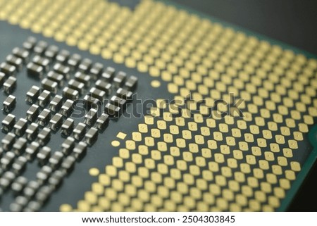This close-up image of a central processing unit (CPU) highlights the precision of the gold contact pins, which are crucial for establishing connections with the motherboard.