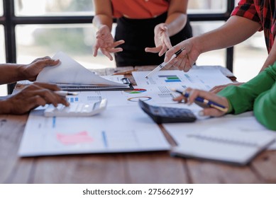 This collaborative scene portrays team members passionately discussing project documents with a focus on analytics and strategy, highlighting the significance of teamwork and communication.