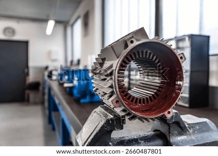 This collection of high-resolution images captures the intricate process of repairing and assembling electric motors inside a professional industrial workshop.