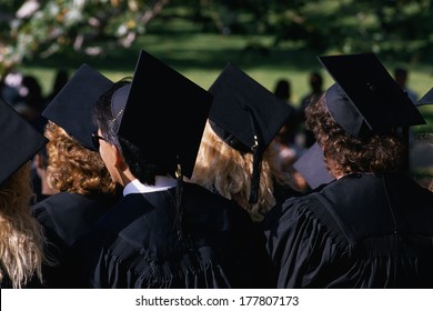 This Is A College Graduation Ceremony At UCLA. They Are In Black Caps And Gowns. 