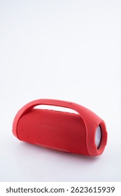 This compact red wireless Bluetooth speaker offers high quality sound and portability, perfect for outdoor use.