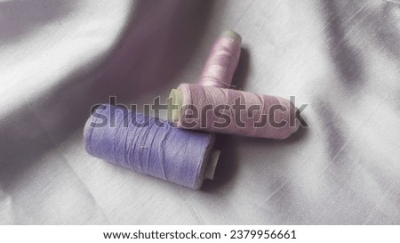 this composition featuring purple threads and fabric signifies the epitome of chic and sophistication